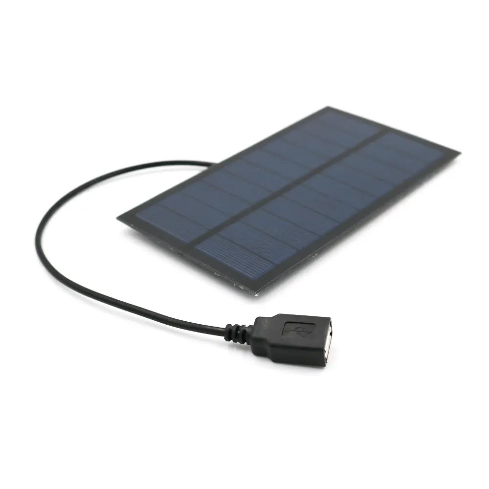 Portable USB Solar Charger solar panel with charging cable for outdoor use.